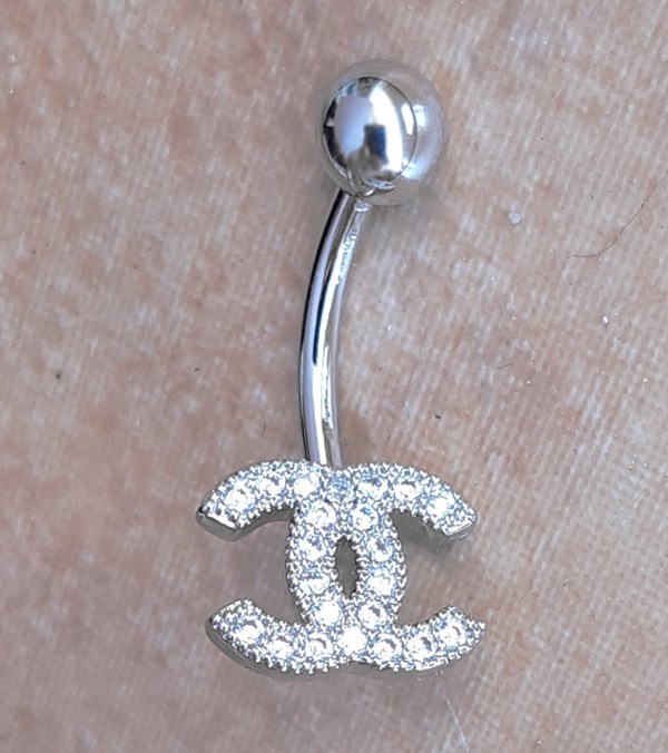 Chanel belly piercing deals